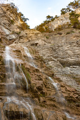 Fototapeta na wymiar Beautiful view on Uchan-su waterfall that falls from the high rock mountain Ah-Petri in Crimea, Russia.