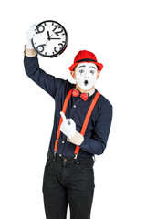 Funny clown with clock isolated on white background.