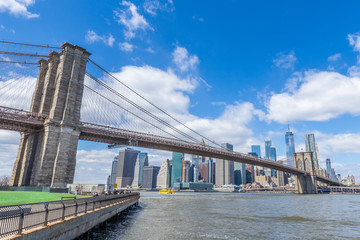 Brooklyn Bridge with Manhattan downtown and Cityscape on sunny day with clear blue sky New York USA
