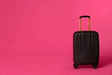 Stylish suitcase on color background. Space for text