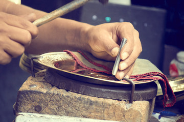 tunisian men working and making traditional copper plates