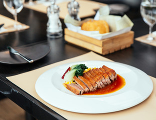Roasted Duck Breast with cream of corn and tamarind poultry jus, Served with bread and butter.