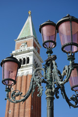 Fototapeta na wymiar a tower and a street lamp of venice on a sunny day