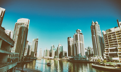 Fototapeta na wymiar DUBAI - NOVEMBER 22, 2015: Beautiful view of Dubai Marina skyline. Dubai is a famous destination for tourists