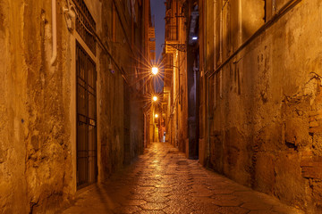 Fototapeta na wymiar Palermo. Old medieval street in night lighting.