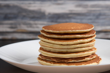 Delicious warm morning pancakes on a white plate