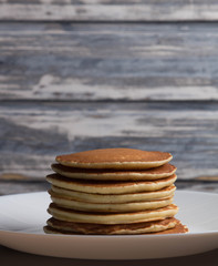 Delicious warm morning pancakes on a white plate