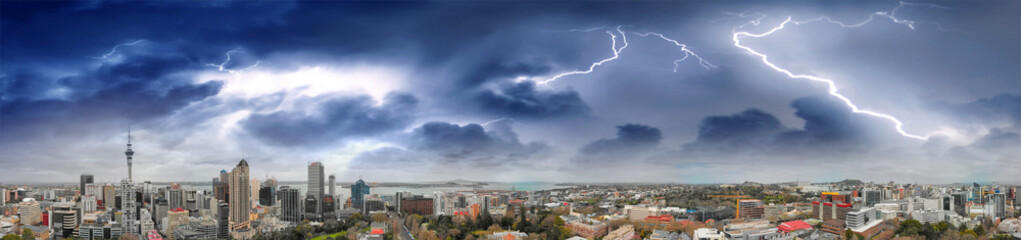 Fototapeta na wymiar Auckland, New Zealand. Panoramic aerial view at sunset during a storm