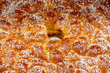 big long pastry sweet pigtail with powder