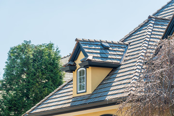The top of the house or apartment building with nice window.