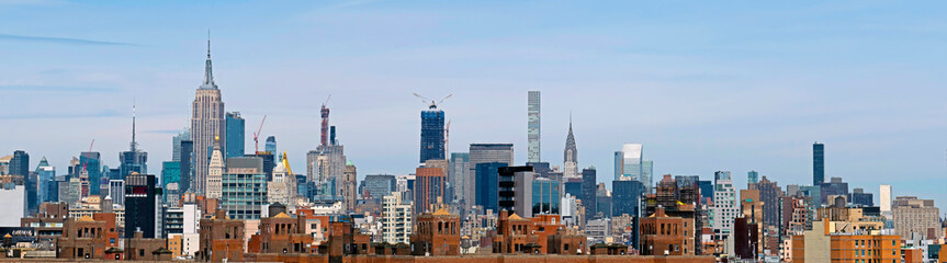 Fototapeta na wymiar Panoramic New York City and Manhattan skyline with the Brooklyn Bridge