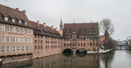 Heilig-Geist-Spital (Hospice of the Holy Spirit) in Old Town Nuremberg. View from the Museum Bridge on the on the River Pegnitz - Nuremberg, Bavaria - Germany