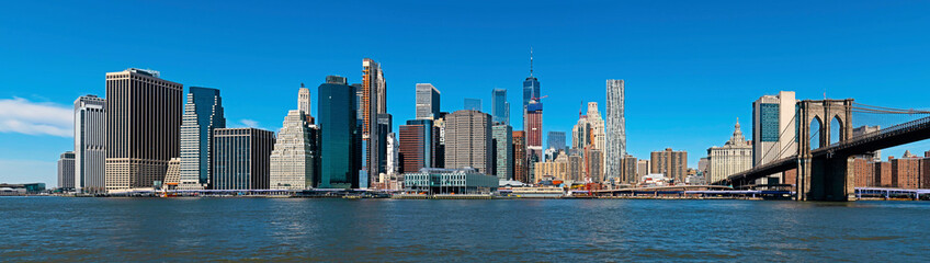 Panoramic New York City and Manhattan skyline with the Brooklyn Bridge