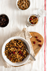 Organic homemade Granola Cereal with oats and walnuts. Oatmeal granola or muesli in bowl. Copy space for text