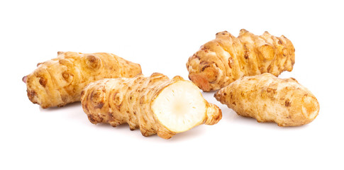 Jerusalem artichoke in bowl on white background
