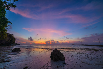Sunriset dramatic sky on sea, tropical desert beach, no people, stormy clouds, travel destination, Indonesia Banyak Islands Sumatra