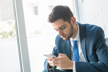Fototapeta premium attractive business man with mobile phone