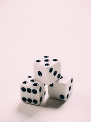 White classic dices on background. Board game