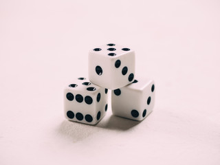 White classic dices on background. Board game