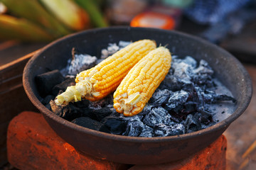 Indian food on the beach - fresh corn cobs are roasted on the coals.