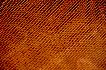 Blurred shedow from perforated mesh on rusty metal sheet. Surface with depth of field.