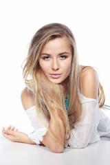 Naklejka premium Beautiful sexual blonde in white clothes isolated on a white background