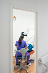 Dentist working in dental clinic