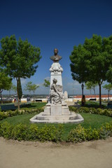 Fototapeta premium Sculpture Of Doctor Barahona In The Garden Of Diana In The City In Evora. Nature, Architecture, History, Street Photography. April 11, 2014. Evora, Portugal.