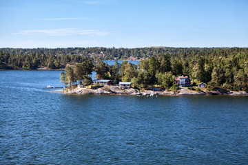 Settlements are on large stones on coastline of Stockholm archipelago in Baltic sea, Sweden, Scandinavia