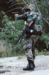 Special forces soldier holding rifle gun