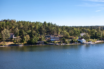 Houses and barns of small settlements on coastline of Stockholm archipelago in Baltic sea, Sweden, Scandinavia