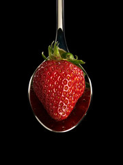 Strawberry in spoon