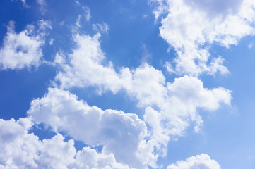 Naklejka na ściany i meble Beautiful white fluffy clouds in the blue sky day, cloud day. It best for background, abstract or blur.