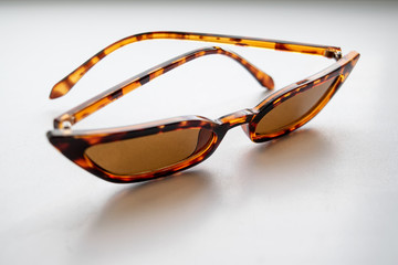 Trendy fashionable sunglasses on a white background