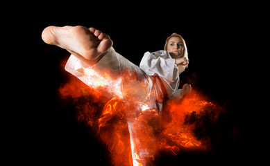 Fototapeta na wymiar Woman in kimono practicing taekwondo