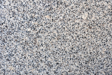Close up of a gray granite wal tevture - image