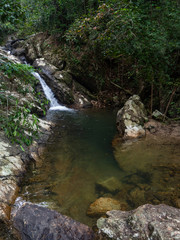 Naklejka na ściany i meble Water bath formed by the waterfall on Koh Phangan. Thailand