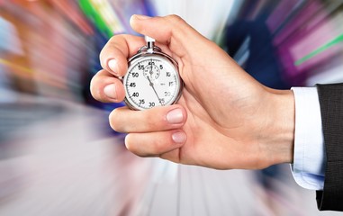 Stopwatch in Human Hand, close-up view