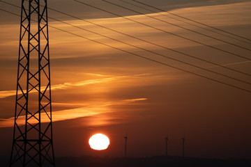 Power line and wind generator at early morning