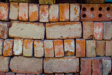Texture Of Red Bricks Stacked. Blocks With Cement And Damages