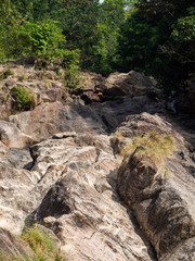 Fototapeta na wymiar The dried up rocky bed of the waterfall on Koh Phangan island. Thailand.