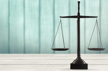 Law scales on table background. Symbol of justice