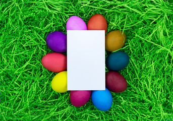 Easter eggs on the grass greeting card with empty field