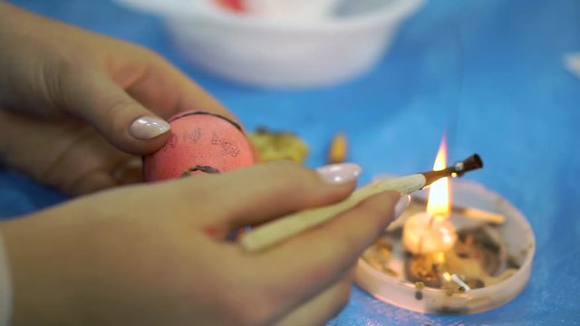 Woman painting easter eggs for holiday, easter preparation concept. cloce up