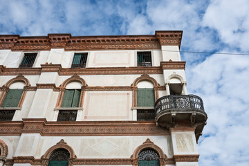 white building with green shutters in  Bassano del Grappa, Italy