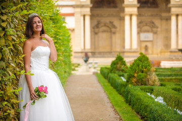Fototapeta premium Charming bride in Wallenstein garden in Prague, Czech Republic