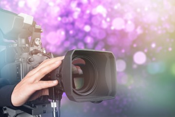 Cameraman with his camera on white background