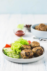 Spicy vegetarian black bean meatballs. Selective focus, space for text.