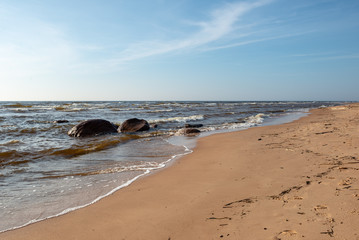 empty sea beach with ice leftovers and no snow