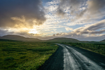 Fototapeta na wymiar A Long Lonely Icelandic Road into the Sunset
